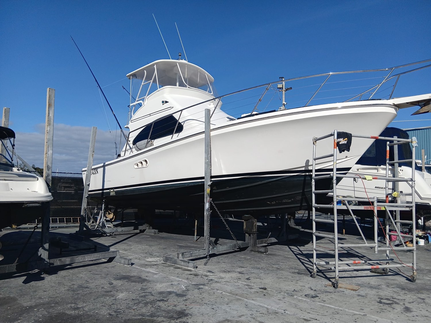 Flybridge game boat detailed and antifouled on the hardstand