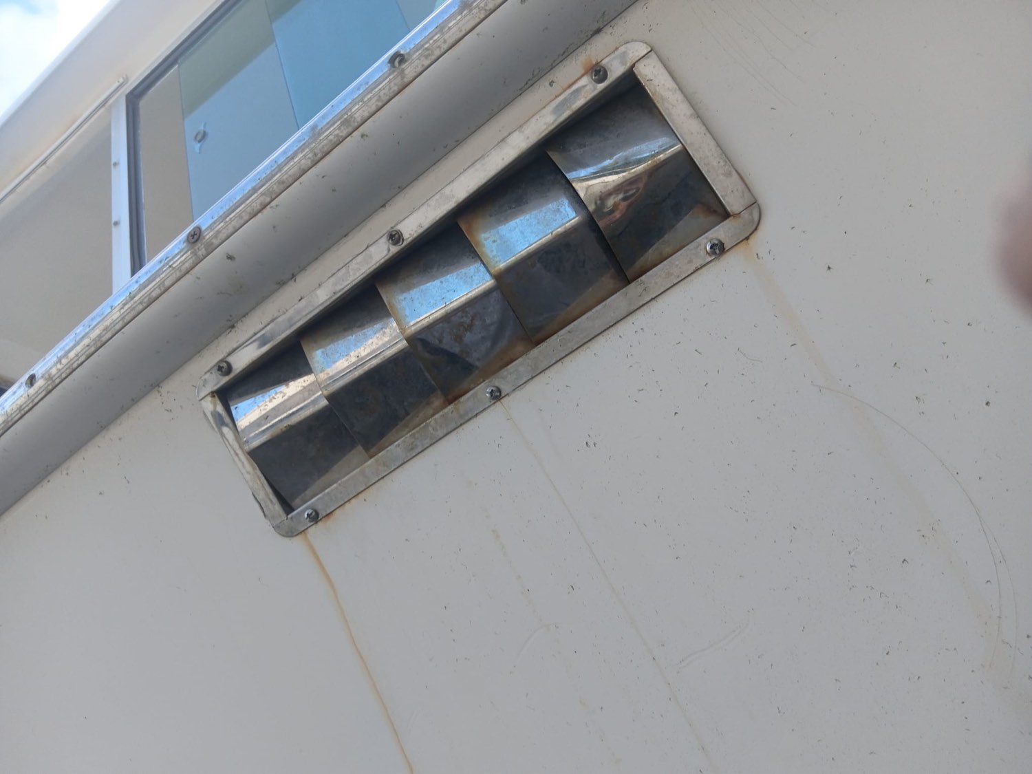 Second corroded stainless vent showing salt and corrosion damage before treatment
