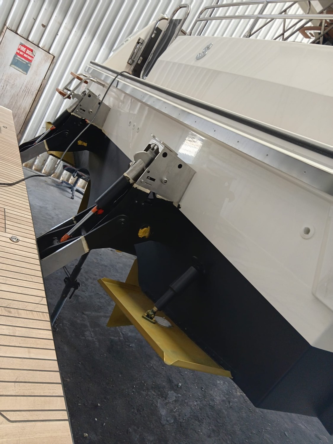 Trim tabs and running gear detailed and coated below the waterline